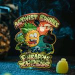 A pack of Activists Edibles Pineapple Xpress THC Gummies, 500mg total dosage, showing vibrant yellow, sugar-dusted tropical gummy bites.