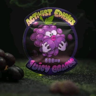 A pack of Activists Edibles Juicy Grapes THC Gummies, 500mg total, featuring deep purple, sugar-coated gummy rounds with a juicy grape flavor profile.