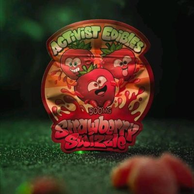 A pack of Activists Edibles Strawberry Swizzle THC Gummies, 500mg total, featuring bright red and white swirled gummy cubes coated in sugar.