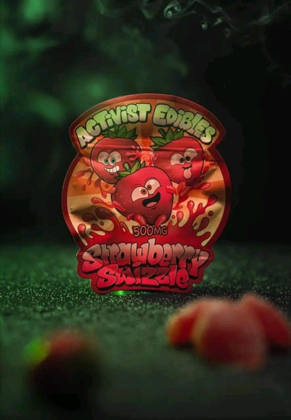 A pack of Activists Edibles Strawberry Swizzle THC Gummies, 500mg total, featuring bright red and white swirled gummy cubes coated in sugar.