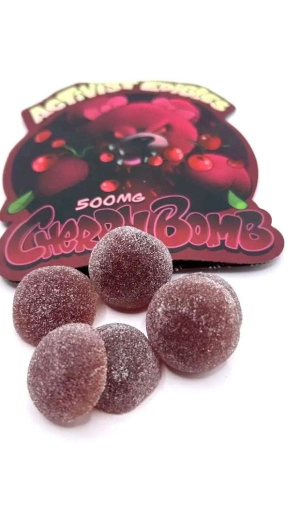 A pack of Activists Edibles CherryBomb Cherry THC Gummies, 500mg total THC, featuring deep red, sugar-dusted gummy rounds.