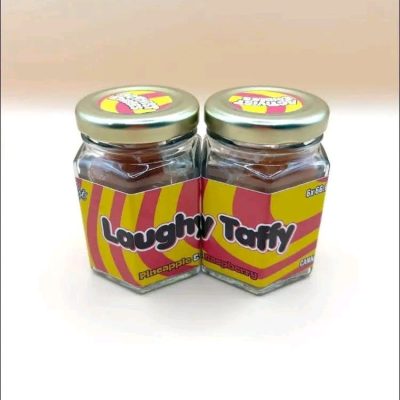 A pack of Activists Edibles Laughy Taffy Watermelon THC Gummies, 500mg total dosage, showing bright green and pink sugar-coated candies.