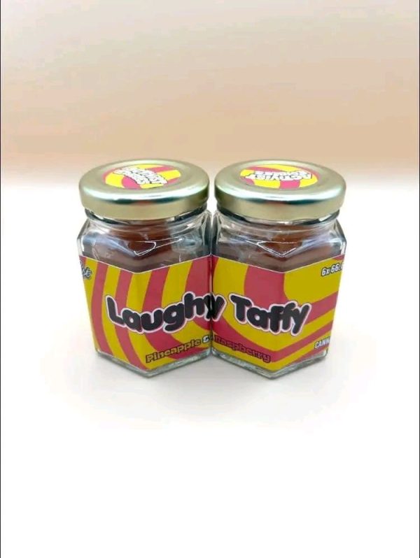 A pack of Activists Edibles Laughy Taffy Watermelon THC Gummies, 500mg total dosage, showing bright green and pink sugar-coated candies.