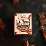 A jar of Activists Edibles Chocolate Spread with a smooth, glossy texture, infused with 500mg THC for high-potency edible dosing.