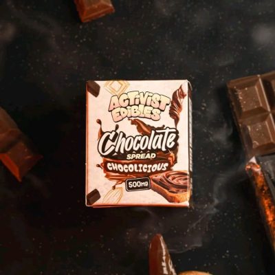 A jar of Activists Edibles Chocolate Spread with a smooth, glossy texture, infused with 500mg THC for high-potency edible dosing.